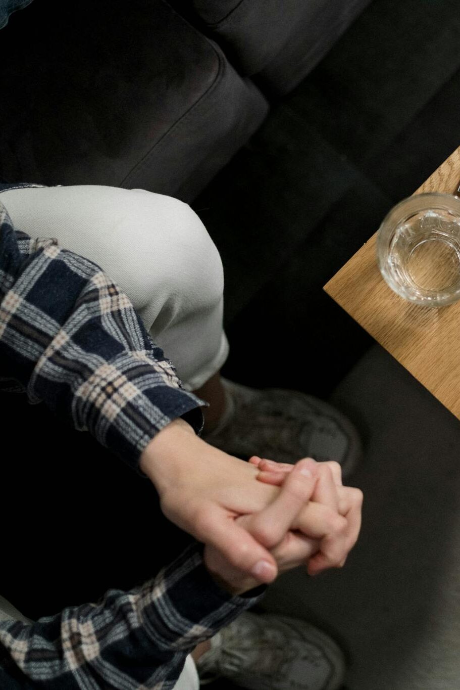 Overhead view of mental health brochures and medication on table in a calming environment.